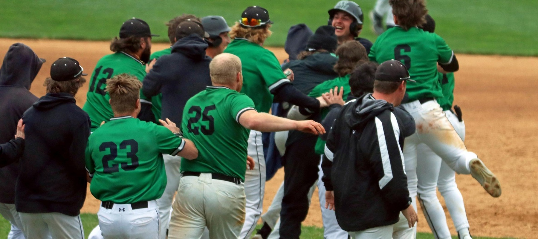 Photo of the team rushing the field to celebrate Dom Grady hitting the walk-off single in game one, 4-3, in the bottom of the 10th inning. Copyright 2023; Wilmington University. All rights reserved. Photo by Dan Lauletta.