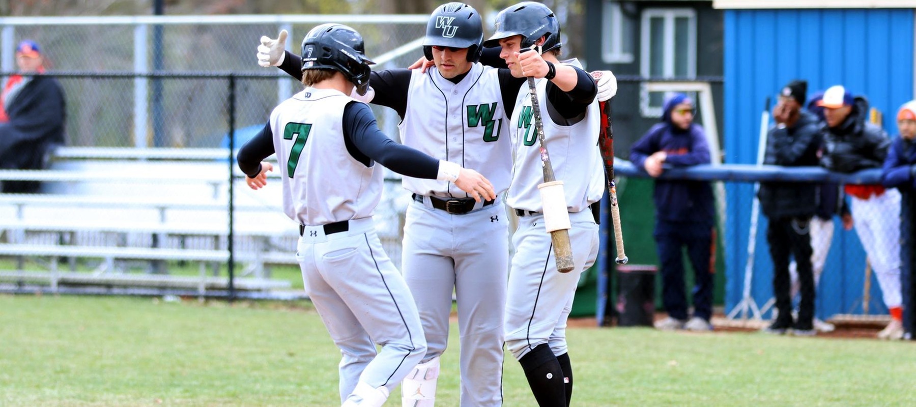 Photo of Brandon Grygo meeting his teammates at home plate following his leadoff homer in game one. Copyright 2025; Wilmington University. All rights reserved. Photo by Dan Lauletta. April 13, 2025 at Lincoln University.