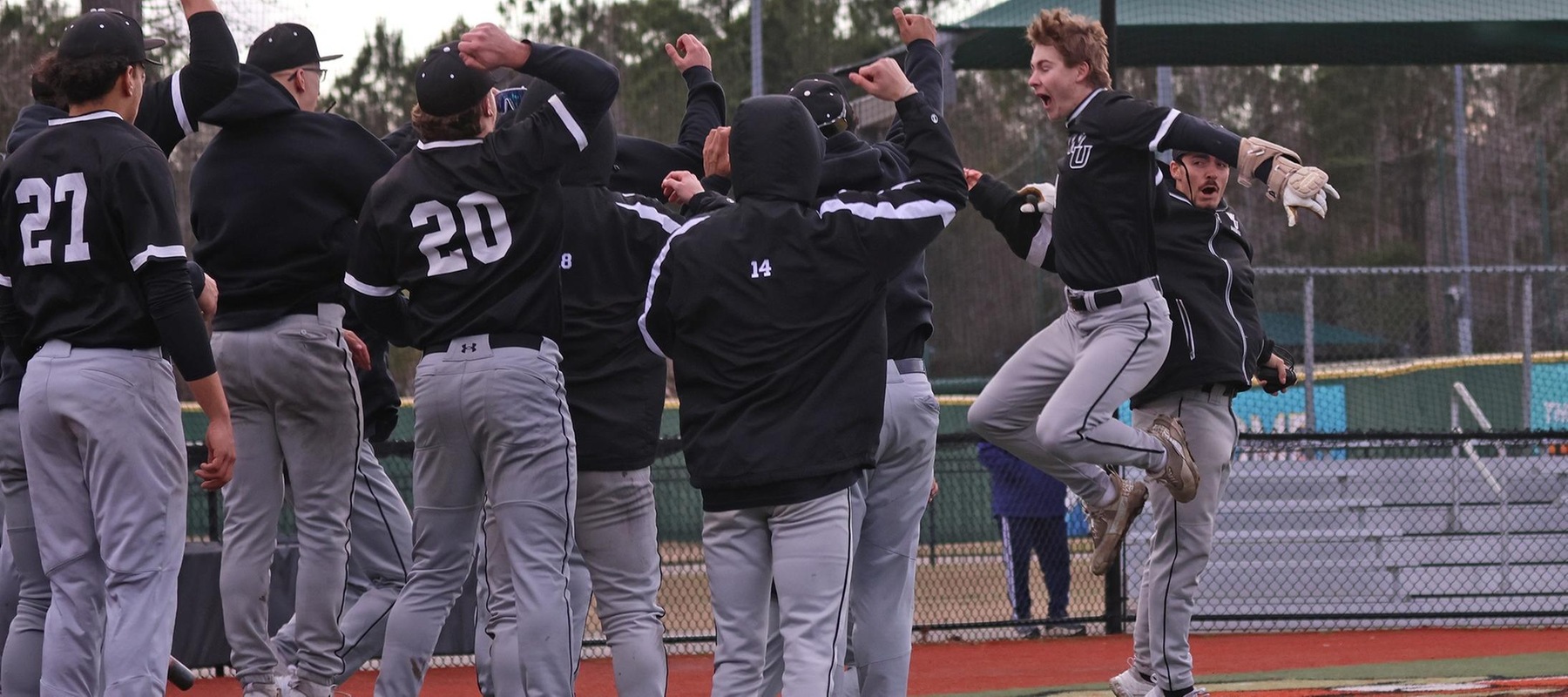 Photo of Tre Villanova (right) celebrating his home run in the ninth against SCSU. Copyright 2026; Wilmington University. All rights reserved. Photo by Trudy Spence. February 22, 2026 vs. SCSU in Myrtle Beach, S.C.