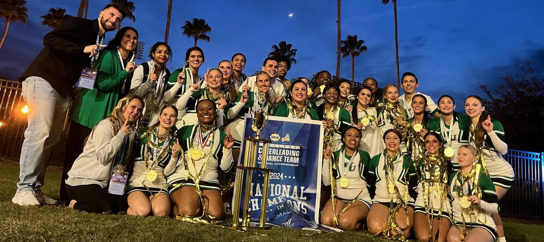 Photo of the 2023-24 cheer team after winning their 10th UCA National Championship all-time