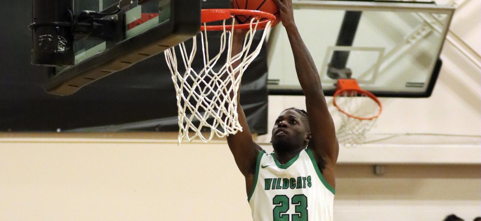 Photo of Amiri Stewart going up for one of his many dunks against UDC. He led the team with 16 points on Wednesday. Copyright 2022; Wilmington University. All rights reserved. Photo by Dan Lauletta. December 14, 2022 vs. UDC.