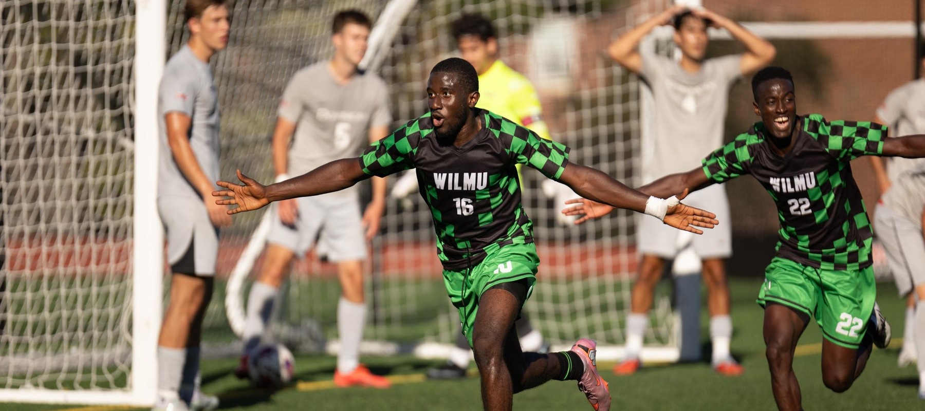 Jacques Mason (left) runs off to celebrate with teammate Alex Tarway after scoring the game-winning goal in the 88th minute at Dominican. Photo taken by Thomas Salus. September 20, 2025 at Dominican.