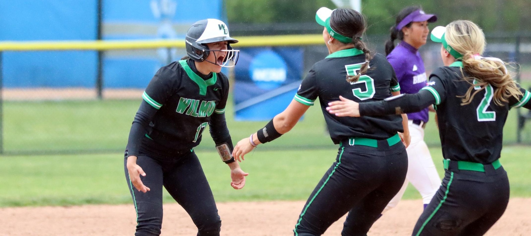 Photo of Tristyn Stewart (17) being greeted by Bella Eleazar (5) and Lexi Moore (2) after hitting the walk-off double against Bridgeport. Copyright 2023; Wilmington University. All rights reserved. Photo by Dan Lauletta. May 5, 2023 vs. Bridgeport in CACC Tournament.