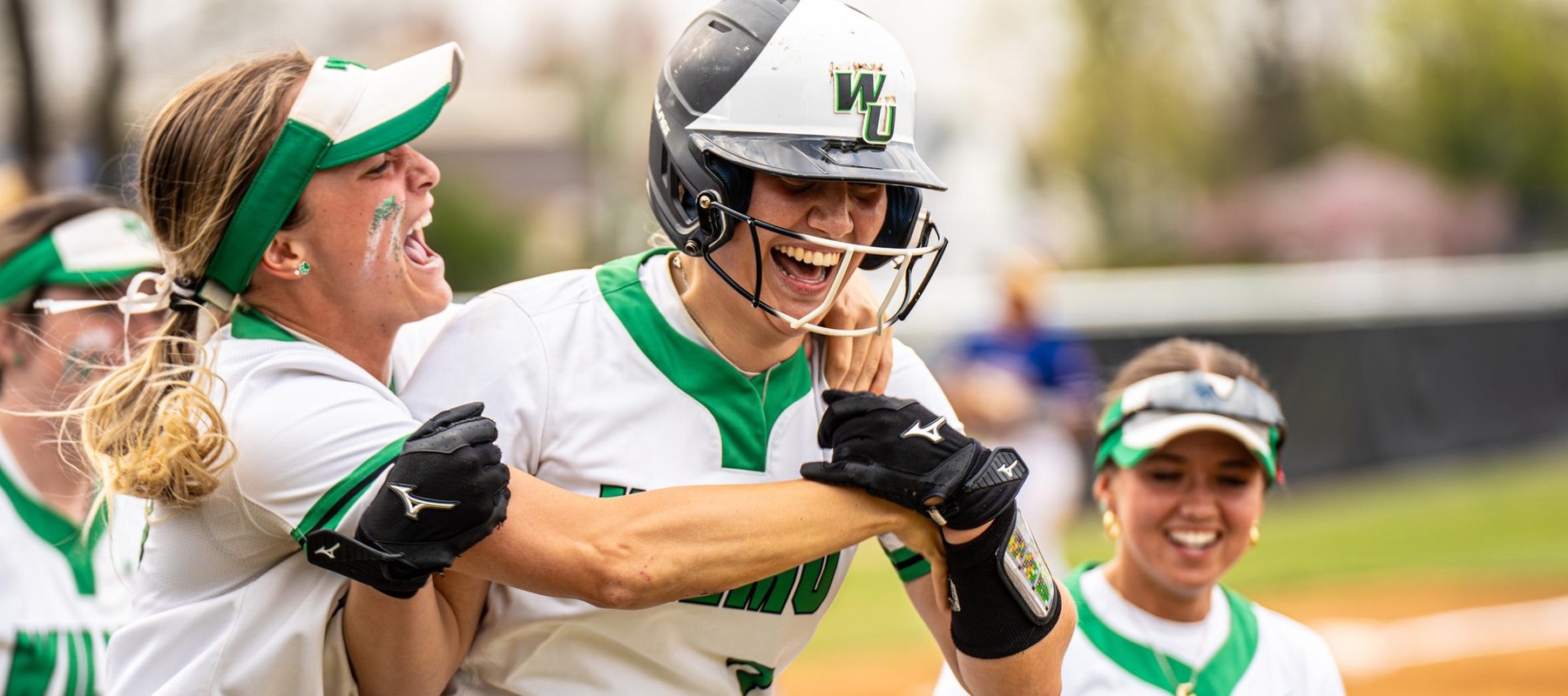Photo of Sara Miller (10) and Alexa Eisemann (3) celebrating Eisemann's walk-off homer in the nightcap against Georgian Court. Copyright 2024; Wilmington University. All rights reserved. Photo by Giovanni Badalamenti. April 10, 2024 vs. Georgian Court.