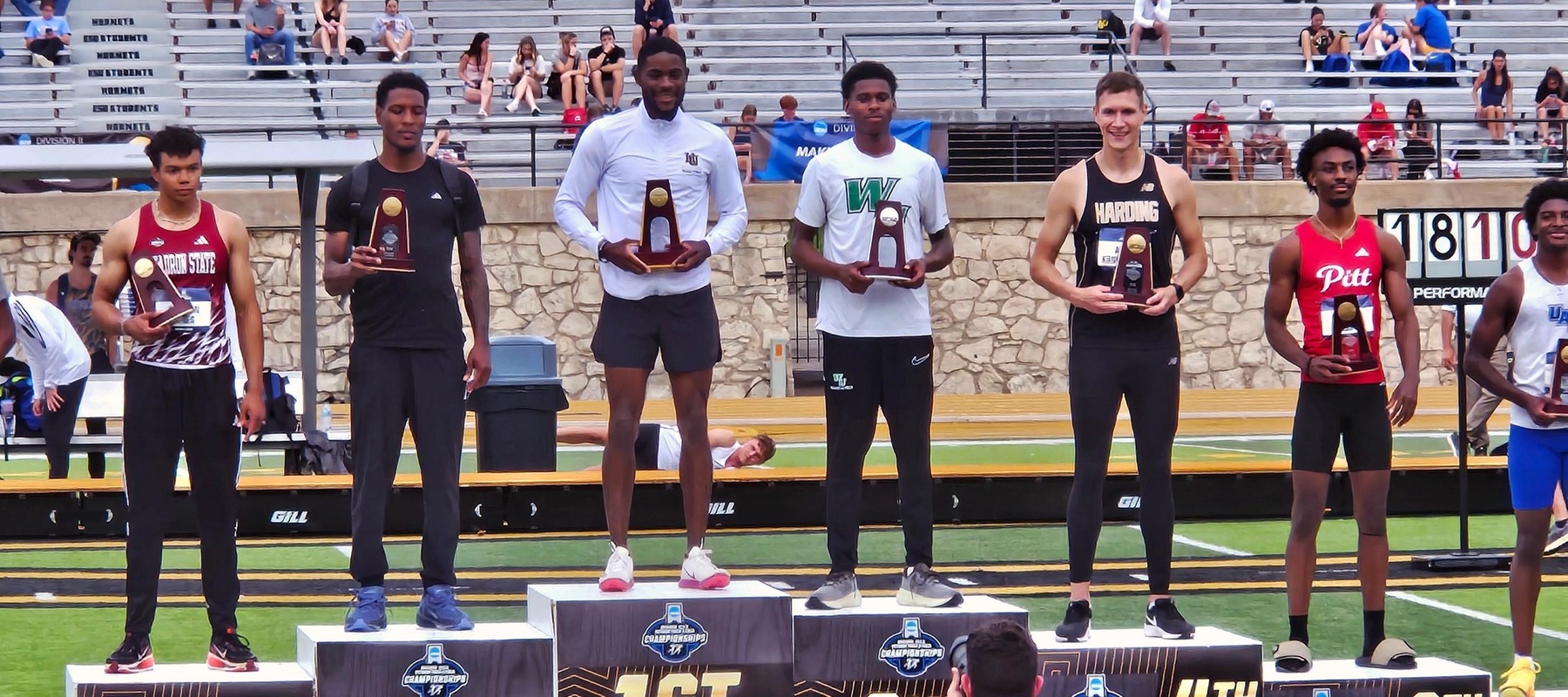Photo of Donte Dockery accepting his Second Place trophy at the 2026 DII Championships. Photo courtesy of head coach James Williams. May 23, 2026, at Emporia State University