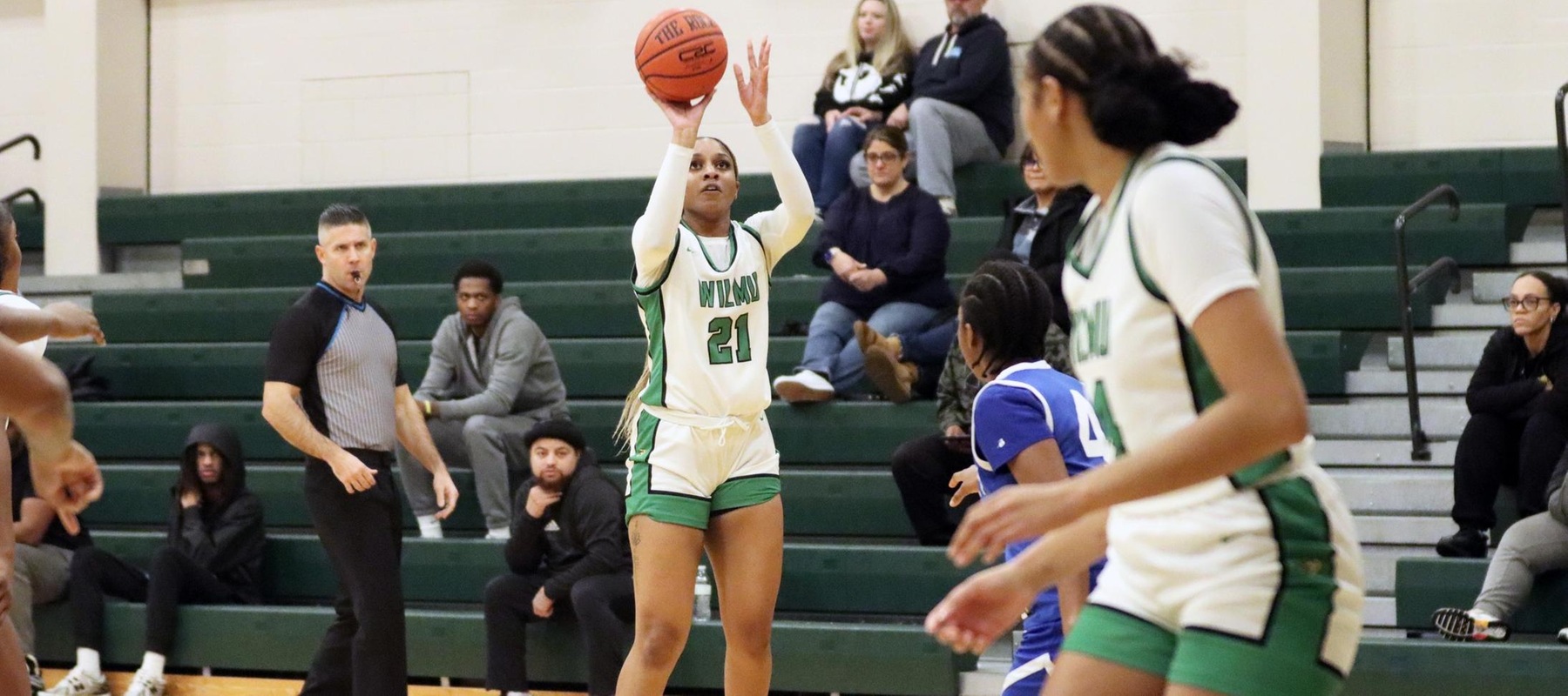 Photo of Aniyah Bond hitting one of her four three-pointers on her way to a double-double against Cheyney. Copyright 2024; Wilmington University. All rights reserved. Photo by Dan Lauletta. December 11, 2024 vs. Cheyney.