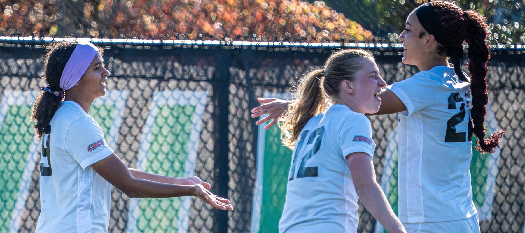 Photo of goal scorers Eboni Bradshaw (left) and Sierra Bartley follow Bradshaw's goal early in the second half. Copyright 2025; Wilmington University. All rights reserved. Photo by Giovanni Badalamenti. October 8, 2025 vs. Georgian Court in CACC Tournament.