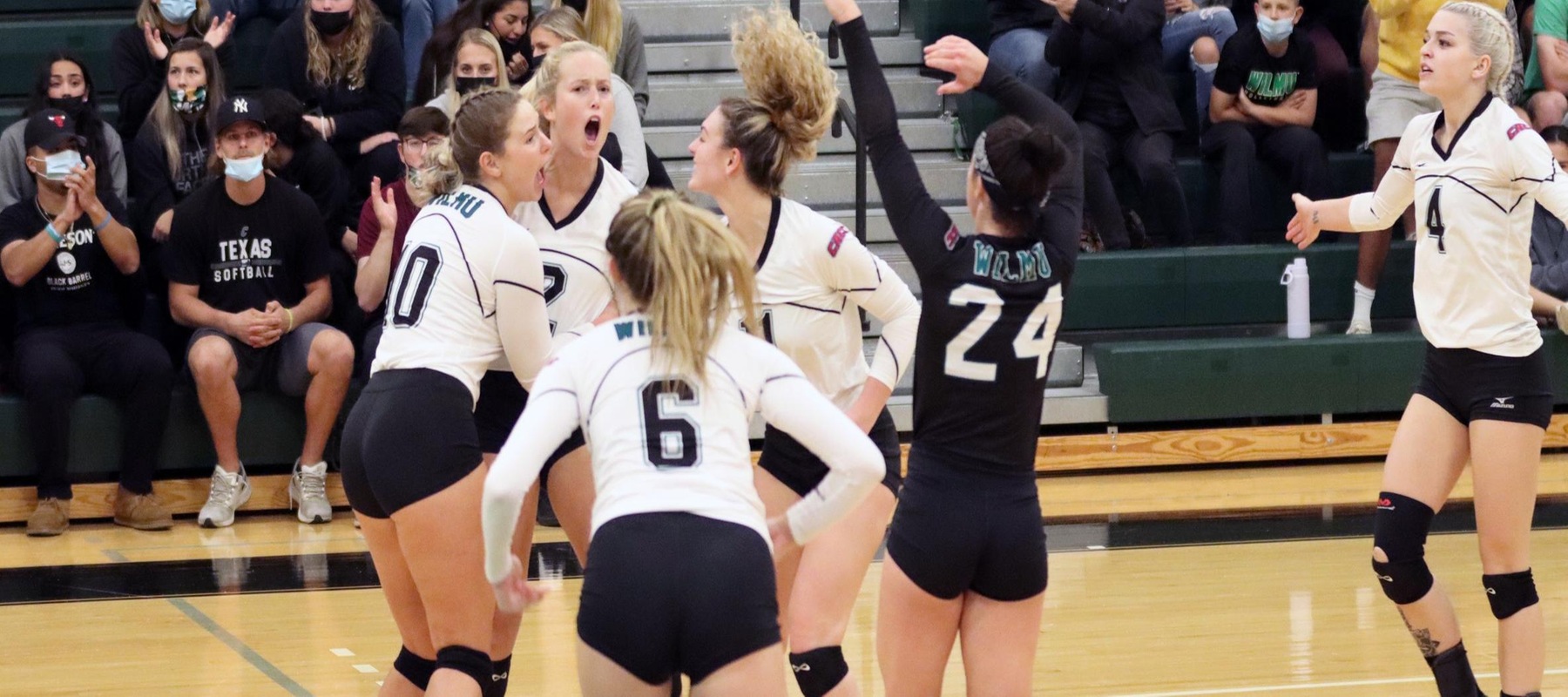 Photo of the Wildcats celebrating following a point in the fifth set against Georgian Court. Copyright 2021; Wilmington University. All rights reserved. Photo by Mitchell Coll. November 10, 2021 vs. Georgian Court.