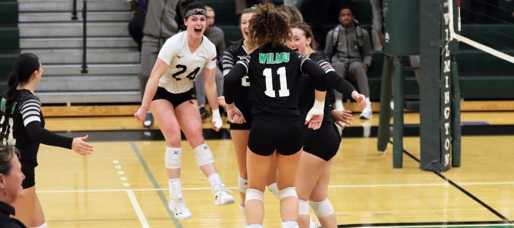 Photo of the Wildcats celebrating match point on Thursday night against Georgian Court. Copyright 2023; Wilmington University. All rights reserved. Photo by Dan Lauletta. October 25, 2023 vs. GCU.